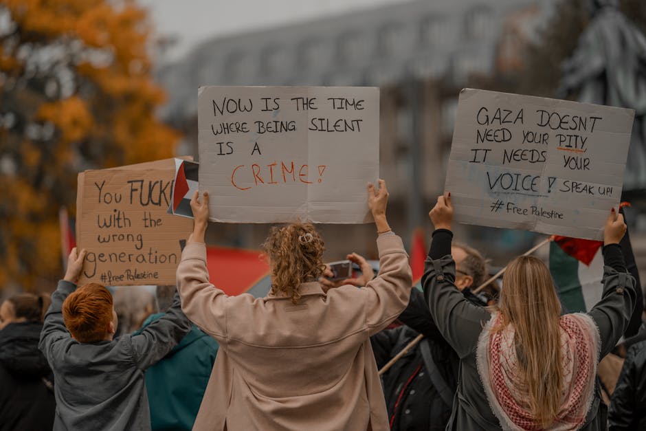 Activists in a city street protest holding signs for awareness and change.