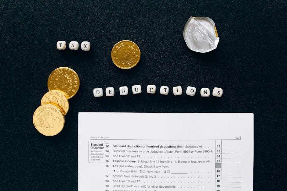 Image of tax deductions concept with coins and tax form on black background.